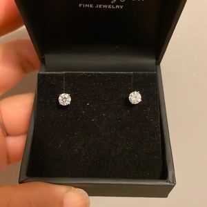 Genuine Diamond Studs 0.50 total carat set in 14 K White Gold.